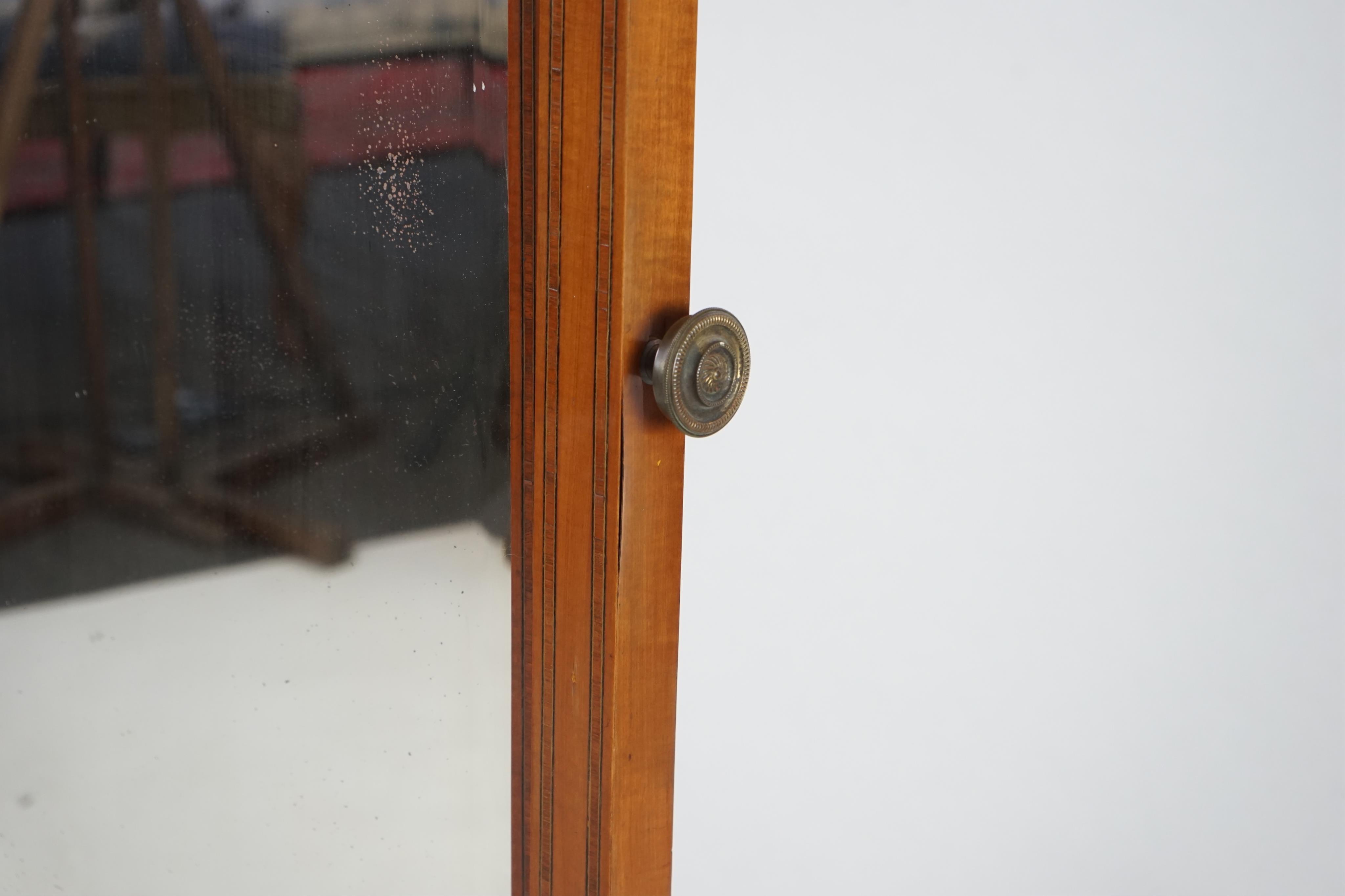 An Edwardian satinwood cheval mirror